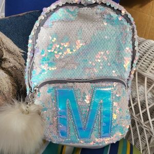 Justice M mini Unicorn backpack.
